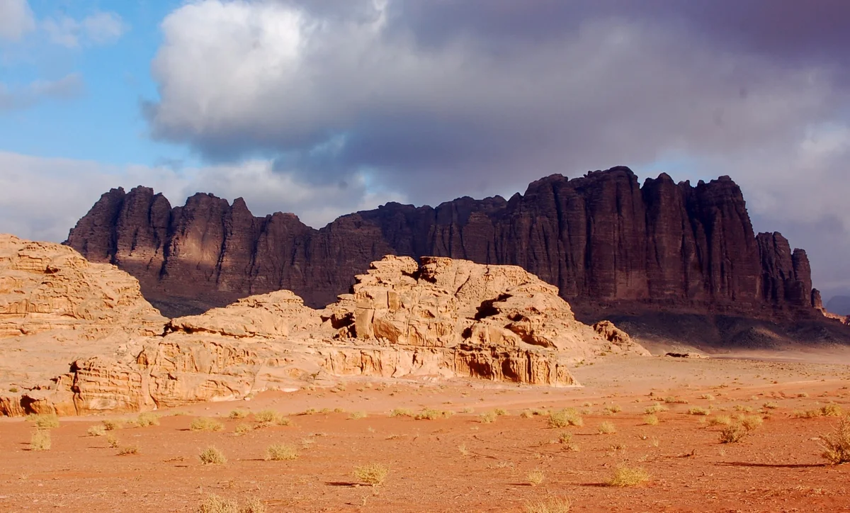Jebel Qatar rising from the sand in the middle of the valley, seen on Wadi Rum desert tours